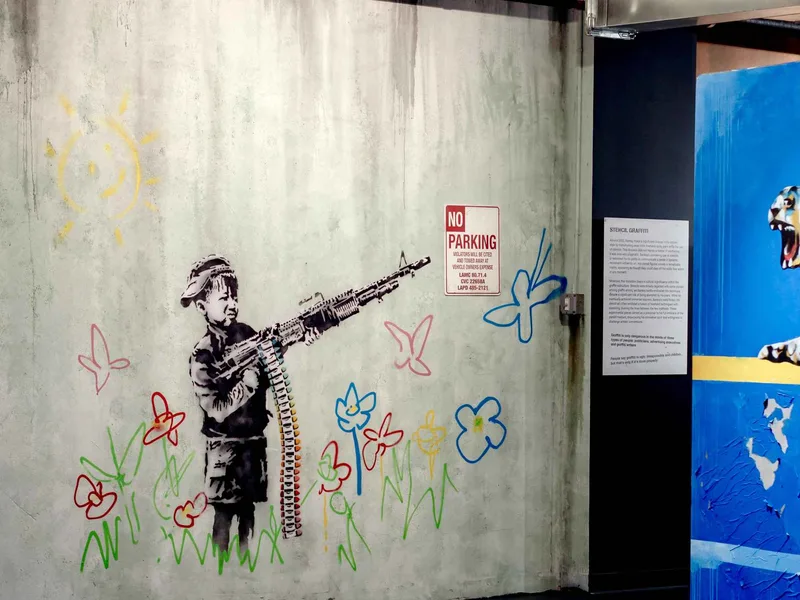 Reproductions of Banksy street-art stencils lining the walls of the Banksy Museum in New York