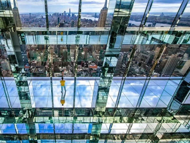 The mirrored glass observation rooms of SUMMIT One Vanderbilt above the New York skyline